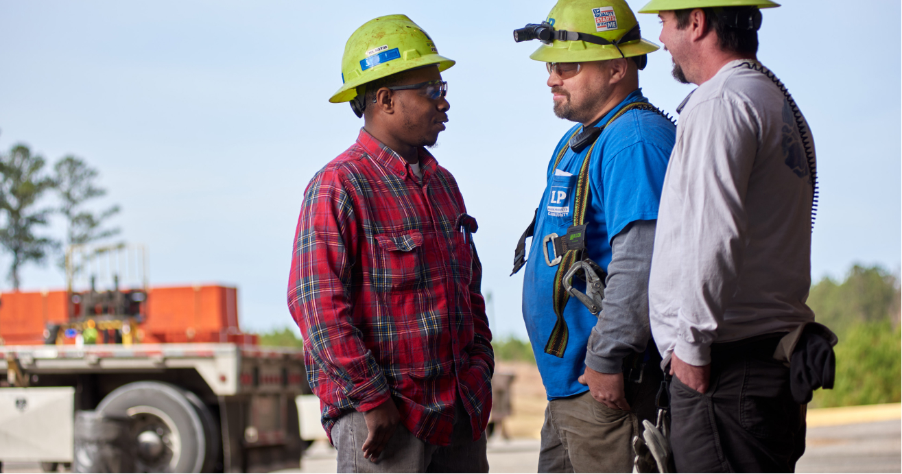 three men in hardhats